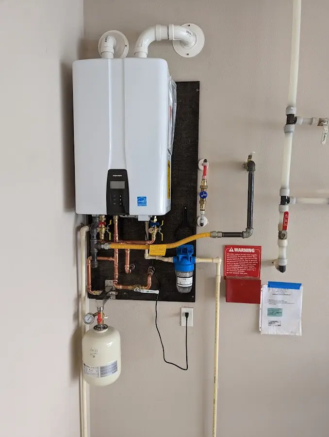 Professional plumber installing copper piping in a Inverness Highlands South home